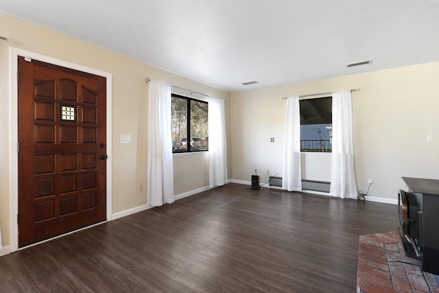 foyer with dark hardwood / wood-style floors