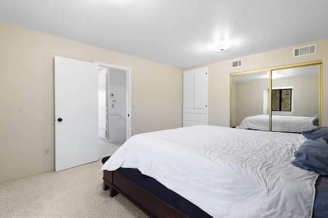 carpeted bedroom featuring a closet