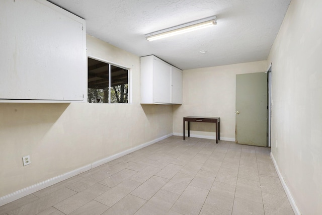 basement with a textured ceiling