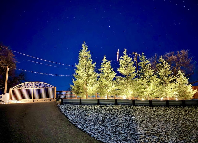 view of yard at twilight