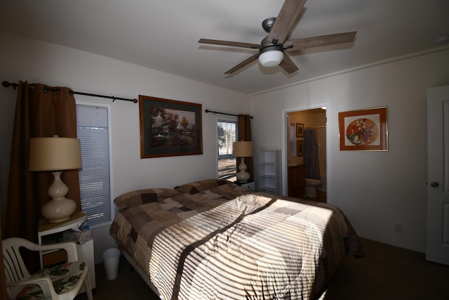 bedroom featuring ceiling fan and ensuite bath