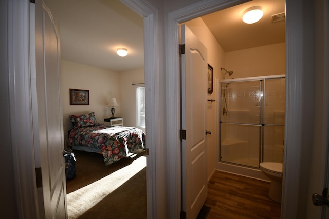 bedroom featuring dark hardwood / wood-style floors