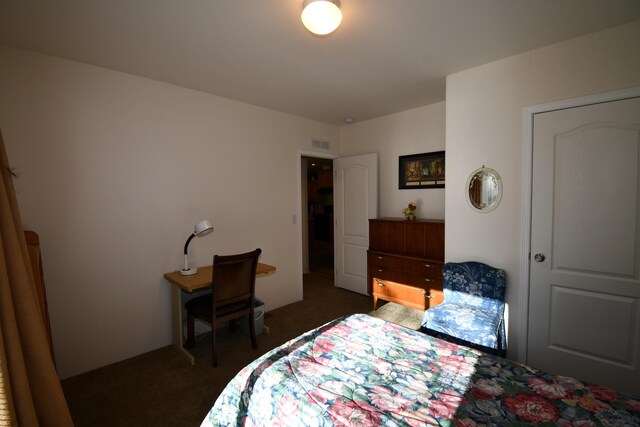 bedroom with dark carpet