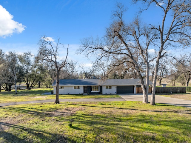 view of front of house with a garage and a front yard