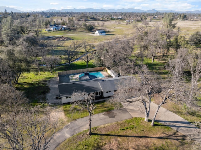 birds eye view of property with a rural view and a mountain view