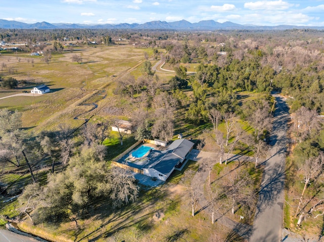 birds eye view of property featuring a mountain view