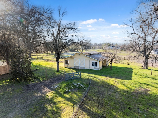 view of yard with a rural view