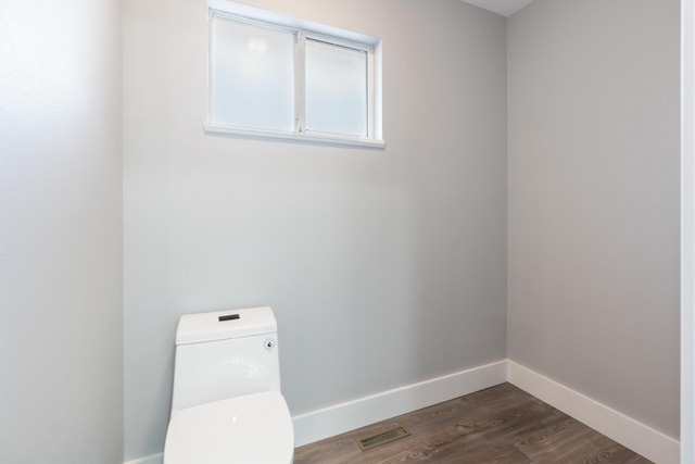 laundry room featuring dark hardwood / wood-style flooring