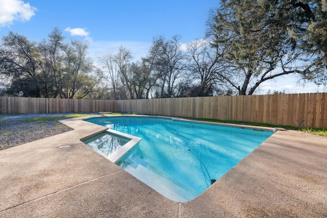 view of swimming pool featuring an in ground hot tub and a patio