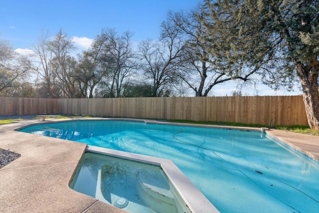 view of pool with a diving board