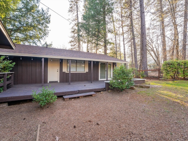 ranch-style home featuring a wooden deck