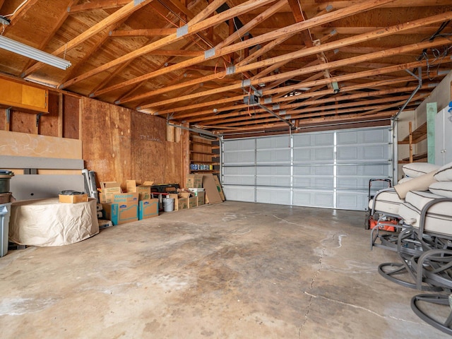 garage featuring wooden walls