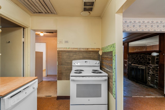 kitchen with crown molding and white appliances