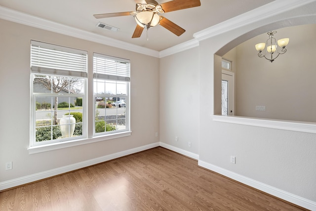 unfurnished room with hardwood / wood-style flooring, ceiling fan with notable chandelier, and ornamental molding