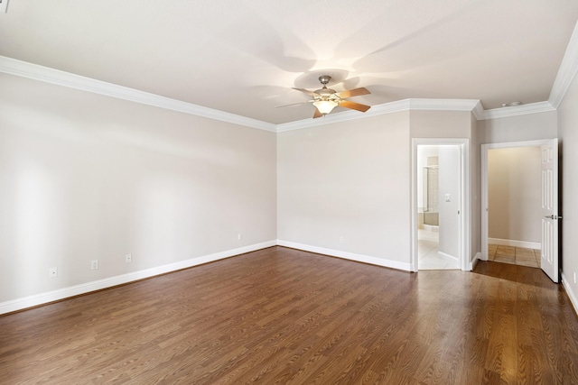 spare room featuring crown molding, ceiling fan, and dark hardwood / wood-style flooring