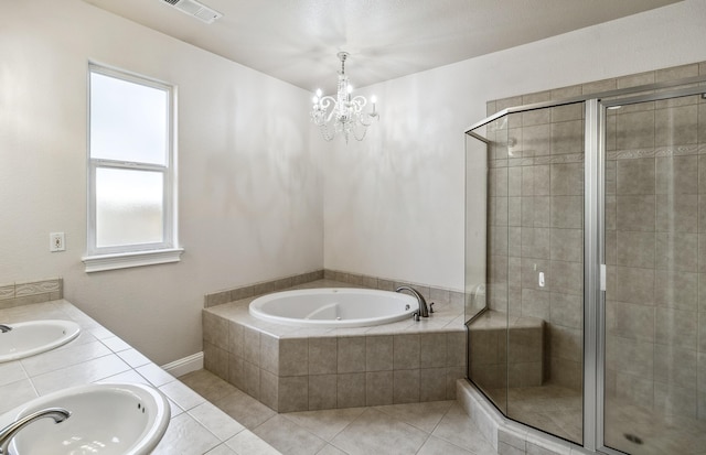 bathroom with tile patterned floors, shower with separate bathtub, and vanity