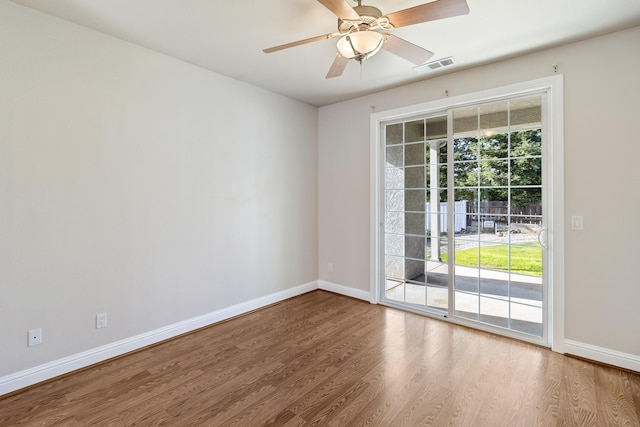 empty room with wood-type flooring and ceiling fan