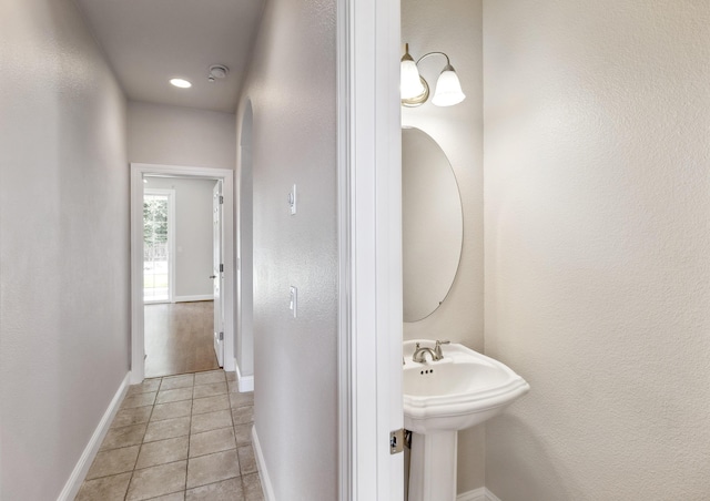 bathroom with sink and tile patterned floors