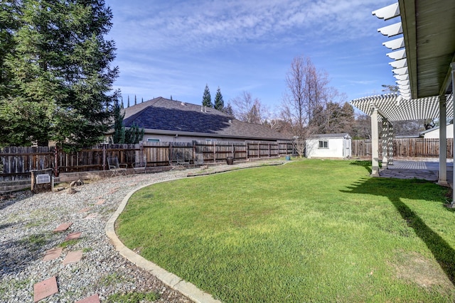 view of yard featuring a pergola and a shed