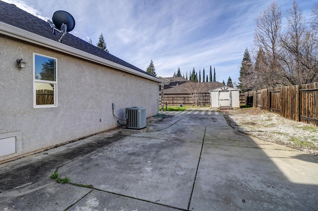 view of patio / terrace featuring a shed and central air condition unit