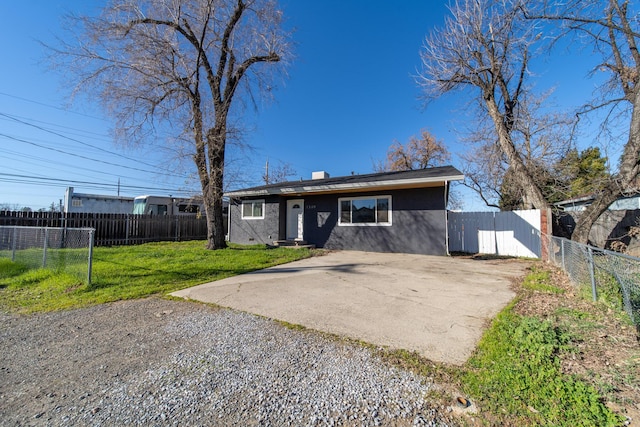 view of front of home with a patio and a front lawn