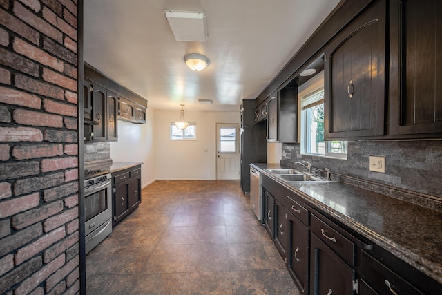 kitchen featuring decorative light fixtures, sink, backsplash, dark brown cabinetry, and stainless steel appliances