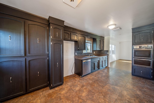 kitchen with sink, dark brown cabinets, wall oven, tasteful backsplash, and stainless steel dishwasher