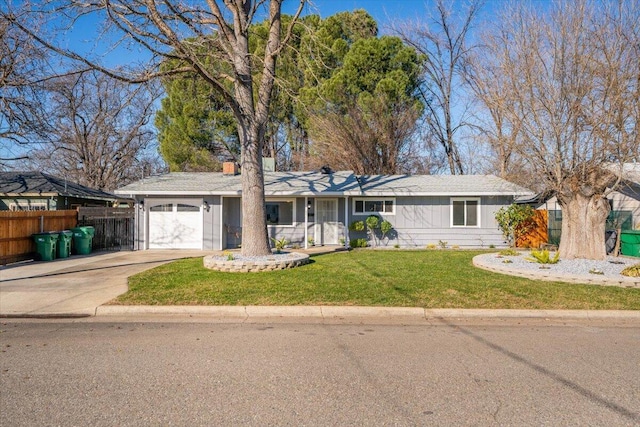 single story home featuring a garage and a front yard