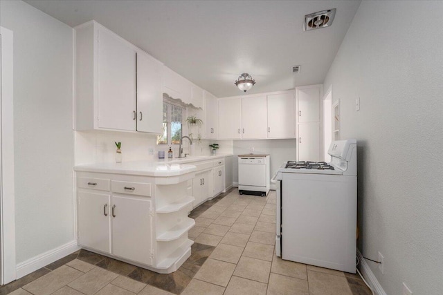 kitchen with sink, white cabinetry, light tile patterned floors, white appliances, and backsplash