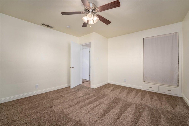 unfurnished bedroom with carpet floors and ceiling fan