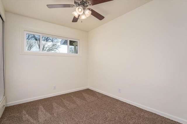 spare room with carpet flooring and ceiling fan