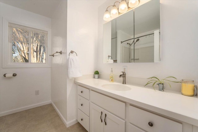 bathroom with tile patterned flooring and vanity