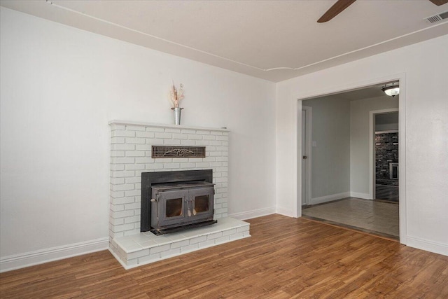 unfurnished living room with hardwood / wood-style floors and ceiling fan