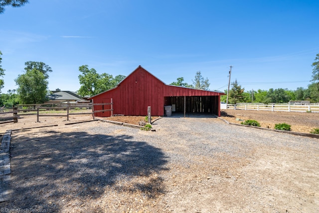 view of outbuilding with a rural view