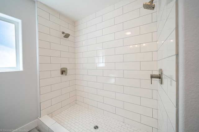 bathroom featuring a tile shower