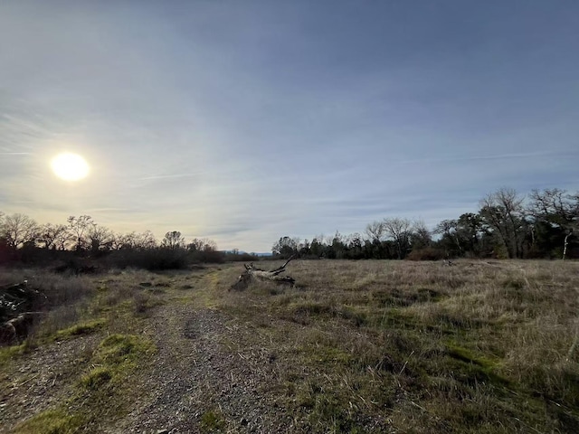 nature at dusk featuring a rural view