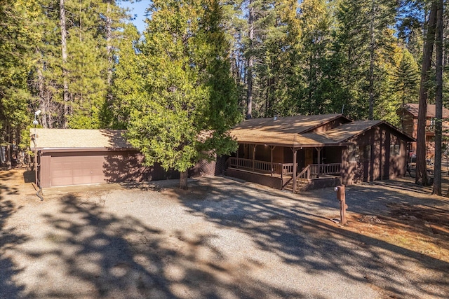 view of front of house with a garage and a porch