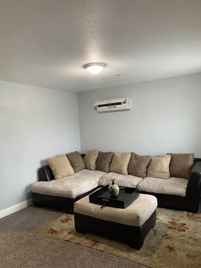 living room with dark colored carpet, a wall mounted air conditioner, and a textured ceiling