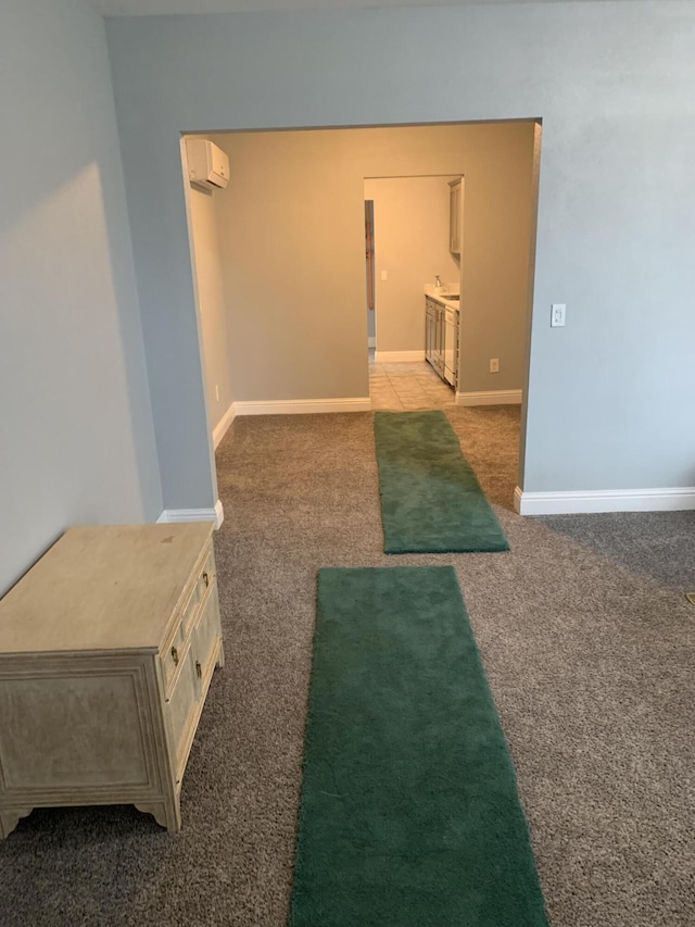 interior space featuring an AC wall unit and carpet floors