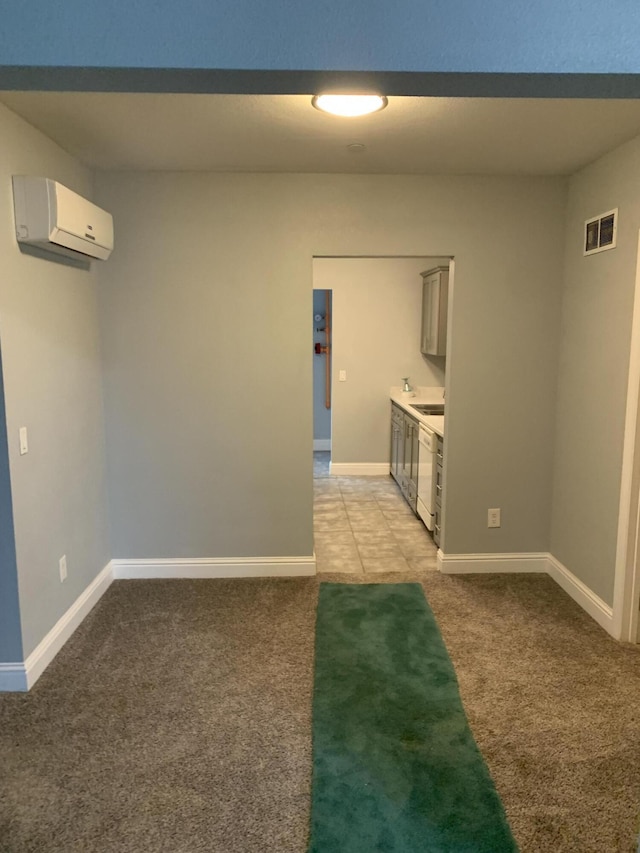 carpeted spare room with a wall mounted AC