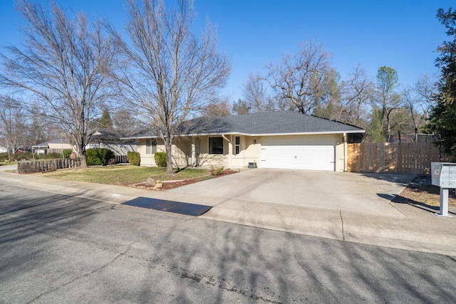 ranch-style home featuring a garage