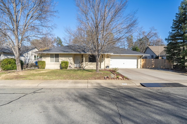 view of front of home with a garage and a front yard