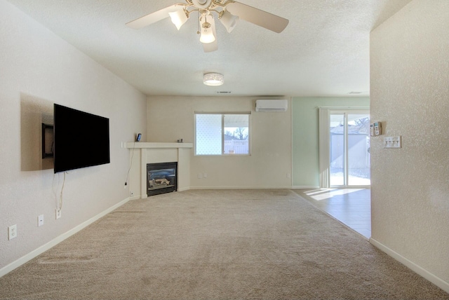 unfurnished living room featuring light carpet, ceiling fan, and a wall mounted AC