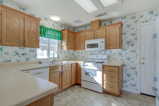 kitchen with sink and white appliances