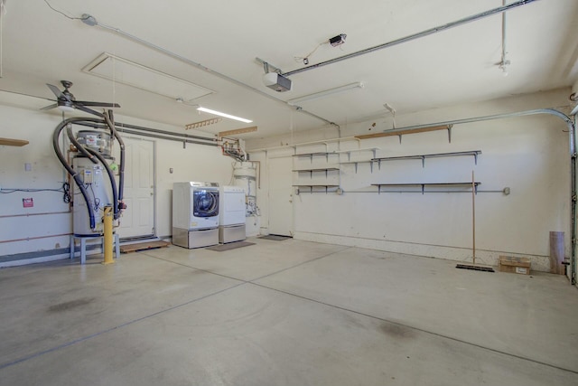 garage with a garage door opener and washer and clothes dryer