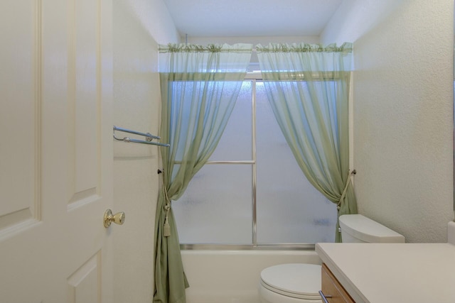 full bathroom with toilet, vanity, and bath / shower combo with glass door