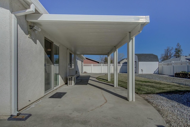 view of patio with a storage unit