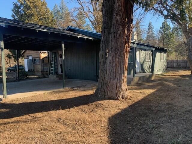 exterior space with a carport