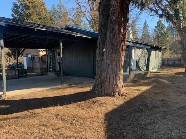 exterior space featuring a carport