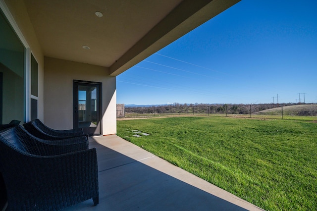 view of yard with a patio and a rural view